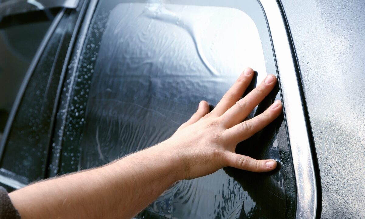 window tinting foil being applied to car